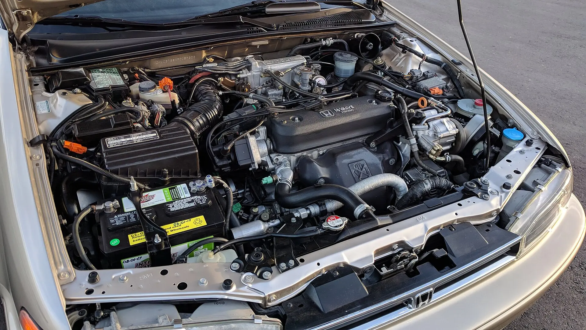 The engine bay of a car with the bonnet open